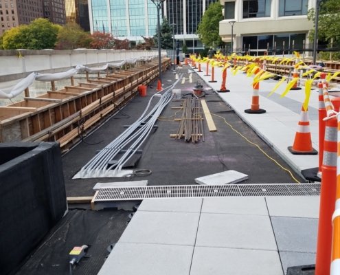 Installing the snow melt system on top of the pedestrian bridge