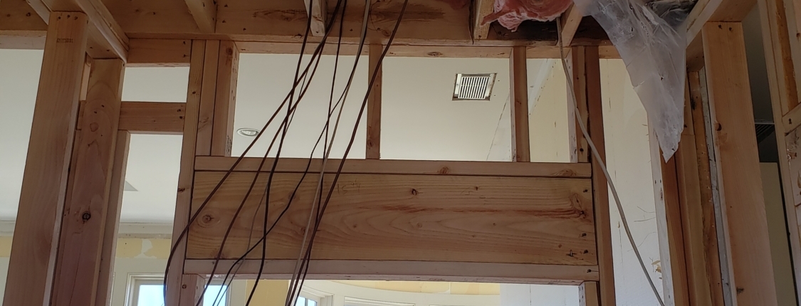 Interior photo of framing and wires