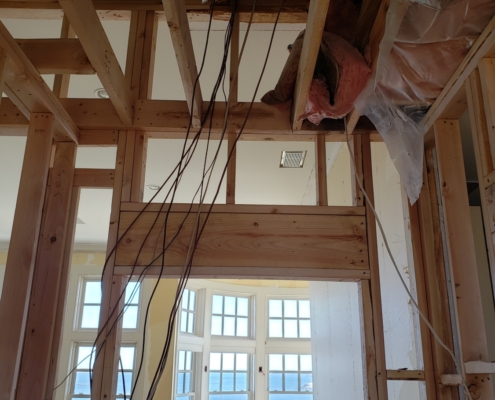 Interior photo of framing and wires