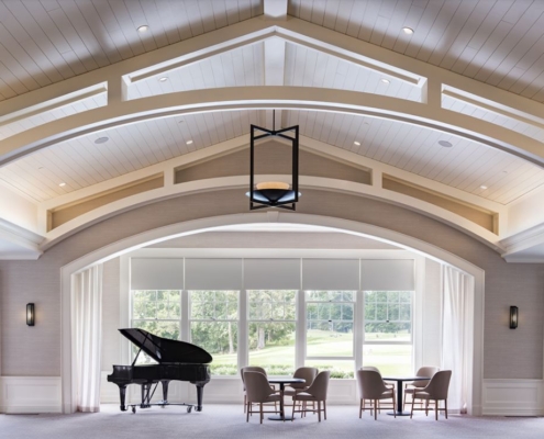 Clubhouse room with grand piano and seating area