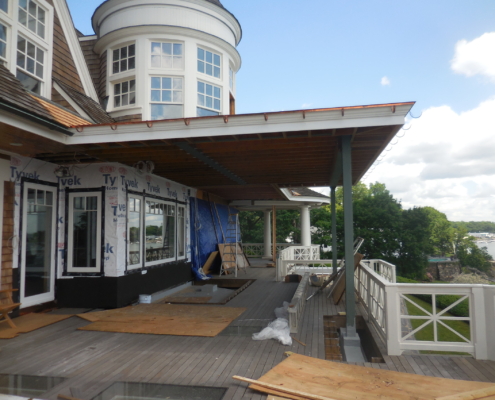 View on the porch looking up toward the house with turret in view