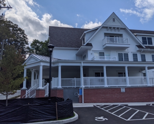 Apartment building with a covered porch