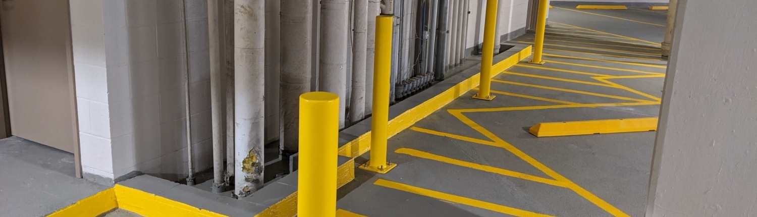 Finished repair area with new lines painted and floor patched