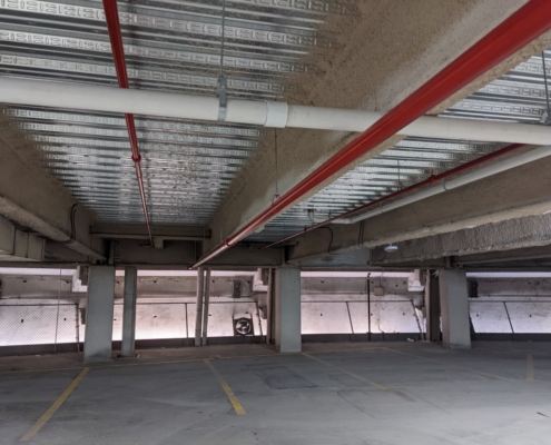 inside garage photo showing pipes on ceiling