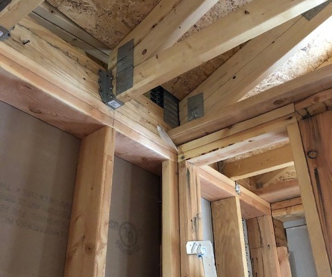 Framing of building showing joist hangars